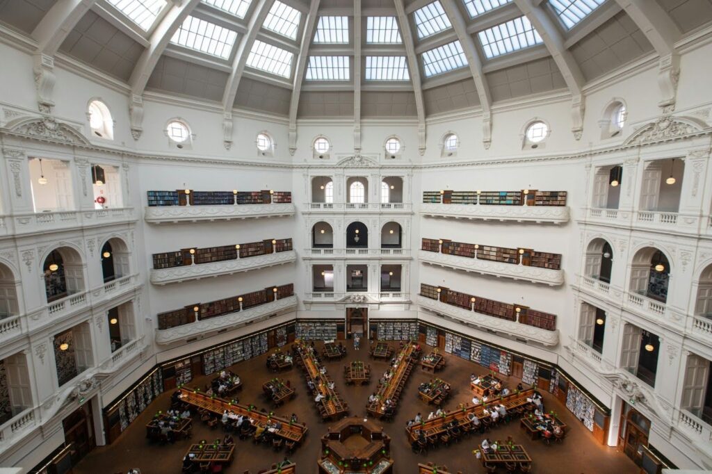 Students studying in a large Australian university library