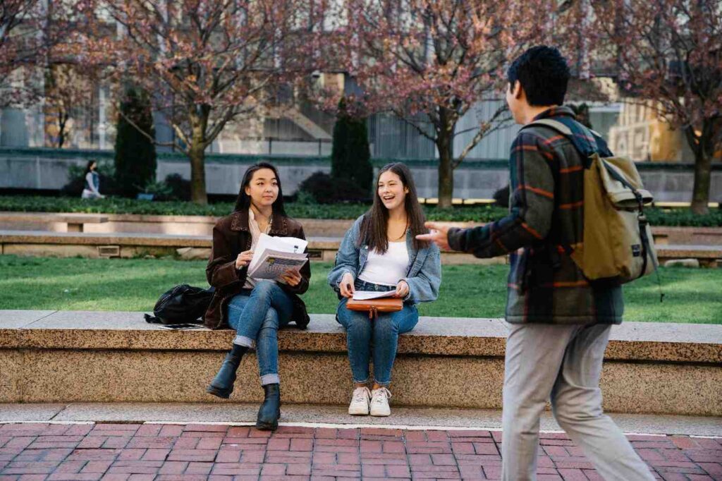 University students sitting on campus and chatting