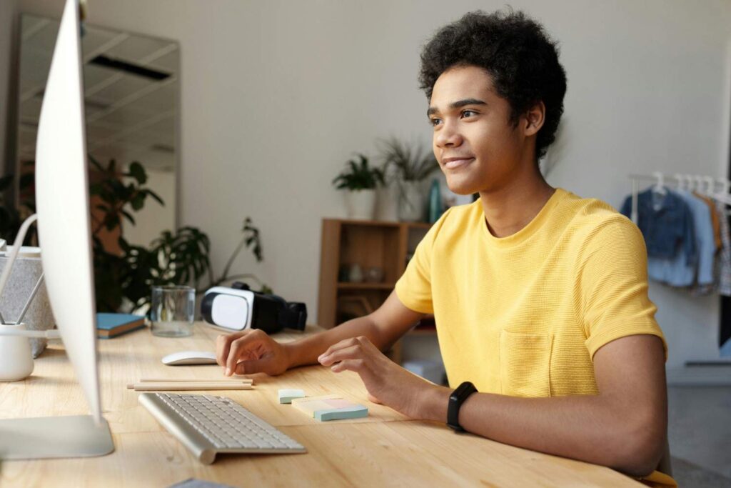 Young student researching online at home